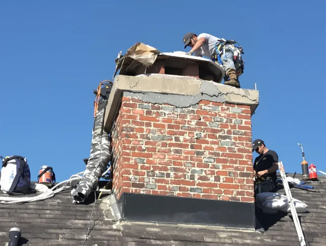 Trumbull Chimney Sweep installing a custom chimney crown in Trumbull, CT