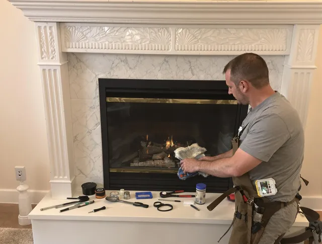 Trumbull Chimney Sweep performing fireplace maintenance in Trumbull, CT