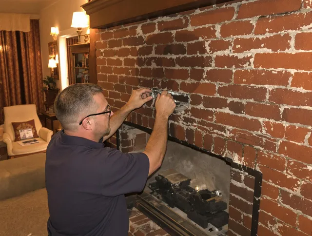 Trumbull Chimney Sweep expert fixing a fireplace in Trumbull, CT